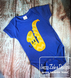 Saxophone with face applique machine embroidery design