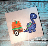 Dinosaur pulling cart with pumpkin appliqué machine embroidery design